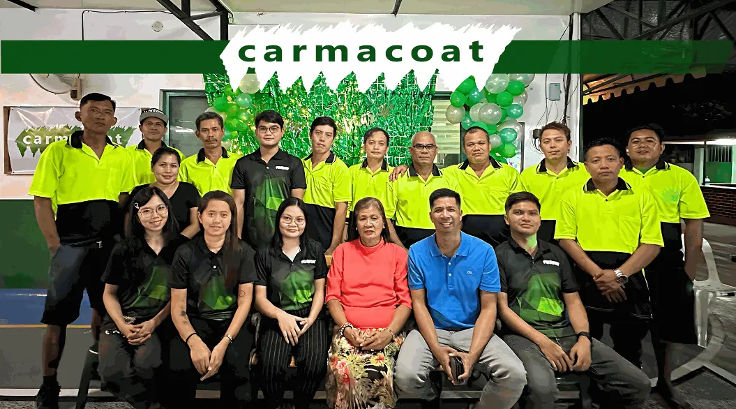 The image depicts the current employees of Carmacoat all in one frame